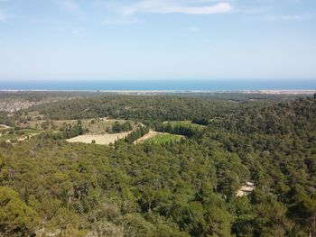 High angle view of landscape and sea against sky