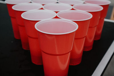 Close-up of red drinking glasses on table