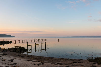 Scenic view of sea against sky at sunset