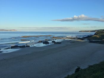 Scenic view of beach against clear sky