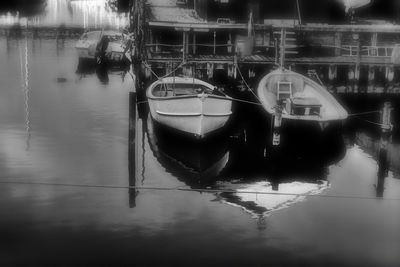 Boats moored in water