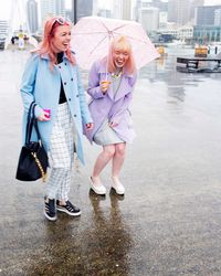 Female friends standing on street