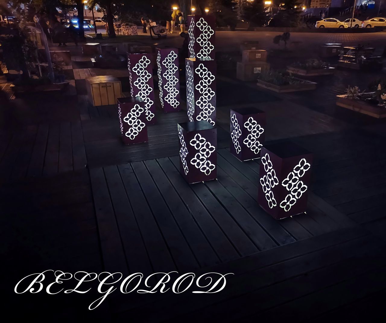 ILLUMINATED CHRISTMAS DECORATIONS HANGING ON TABLE