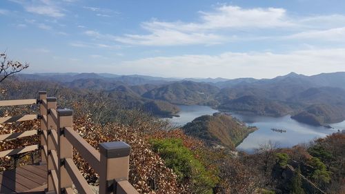 High angle view of mountain range against cloudy sky