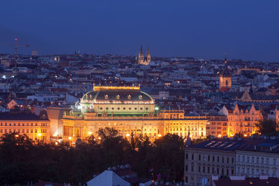 Prague skyline after dark with old town and new town of prague and national theatre.