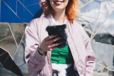 Young woman using mobile phone outdoors