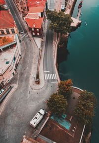 High angle view of road amidst trees in city