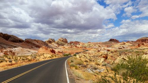 Road amidst landscape against sky