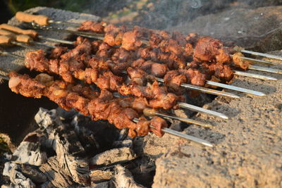 High angle view of meat on barbecue grill