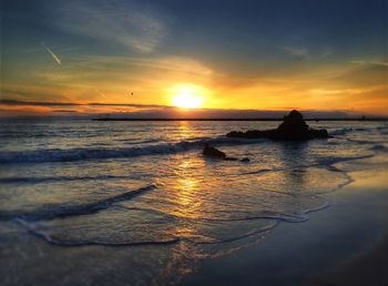 Scenic view of sea at sunset