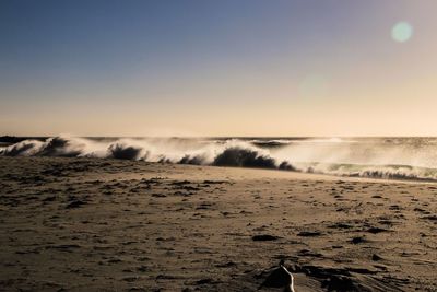 Scenic view of beach against sky