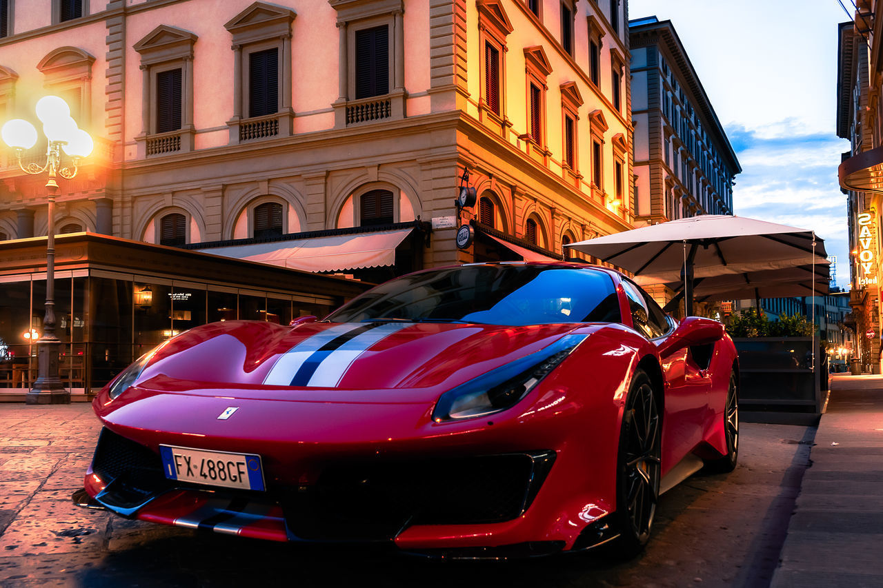 CARS ON CITY STREET BY BUILDING