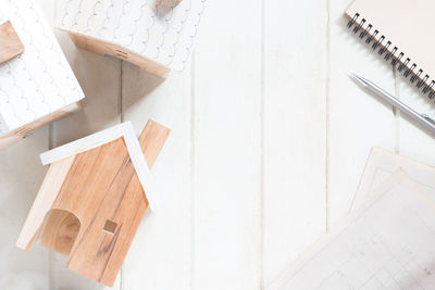 High angle view of paper house on white table