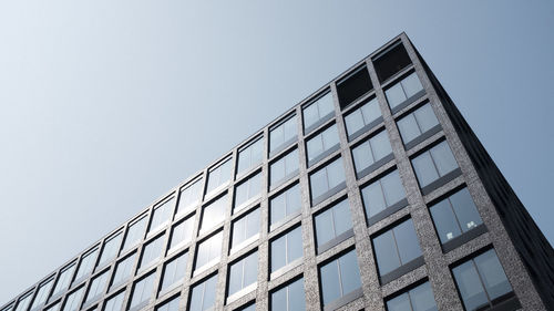 Low angle view of modern building against clear sky