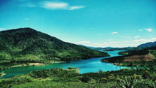 Scenic view of lake against blue sky