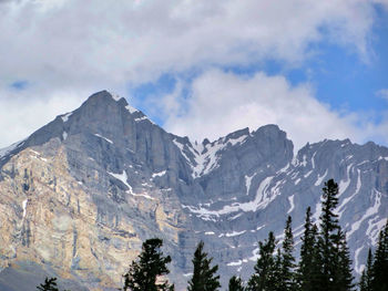 Scenic view of mountains against cloudy sky