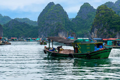 Boats moored in bay