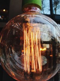 Close-up of illuminated light bulb