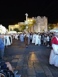 People at night in city