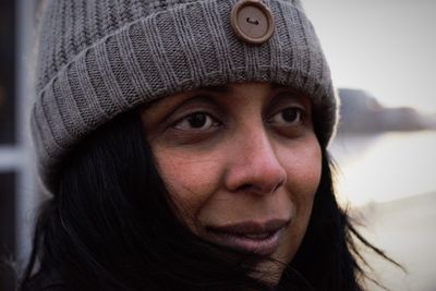 Close-up of woman wearing knit hat