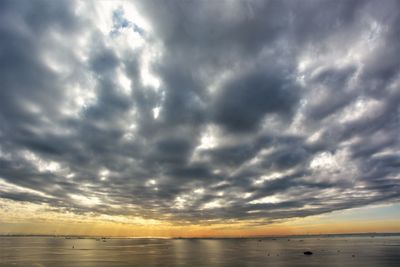 Scenic view of sea against sky at sunset