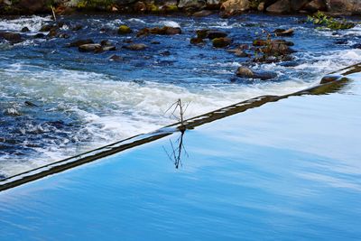 High angle view of water splashing in sea