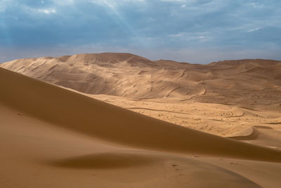 Scenic view of desert against sky