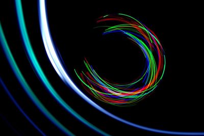 Close-up of light trails against black background
