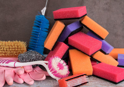 Close-up of multi colored sponges on table