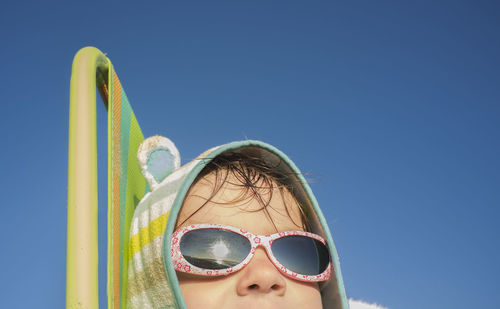 3 years baby boy sitting over beach chair