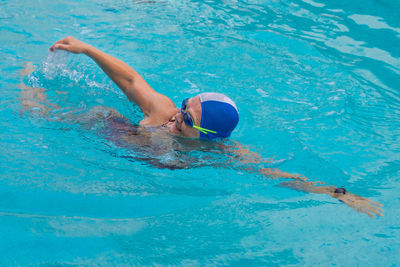 Man swimming in pool