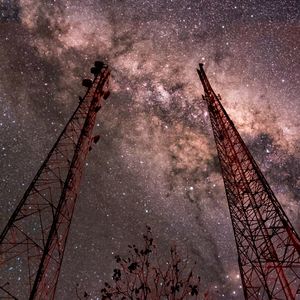 Low angle view of illuminated tower at night