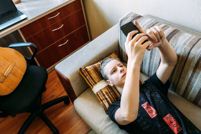 Digital addiction in tweens and teens, smartphone addicted. teenage boy playing online game