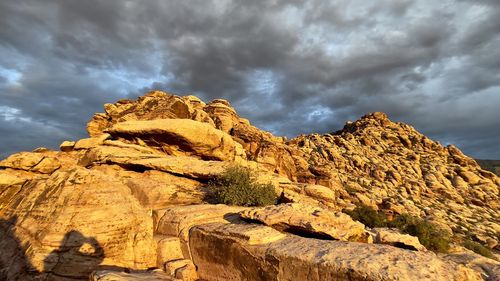 Low angle view of rock formation against sky