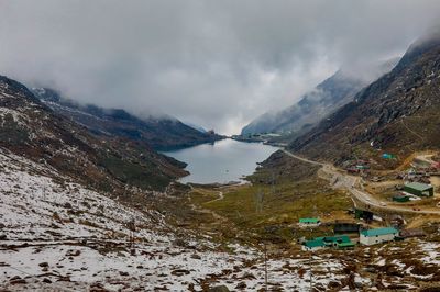 Scenic view of lake against sky during winter