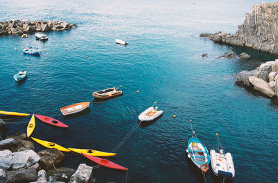 High angle view of sailboats moored on sea