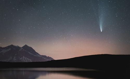 Scenic view of mountains against sky at night