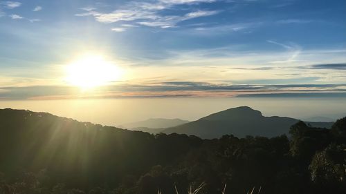 Scenic view of silhouette mountains against sky during sunset