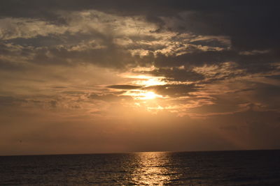 Scenic view of calm sea at sunset