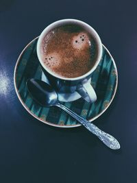 High angle view of coffee cup on table