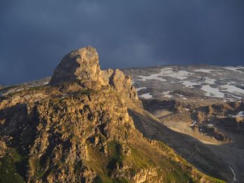 Rock formations on mountain against sky