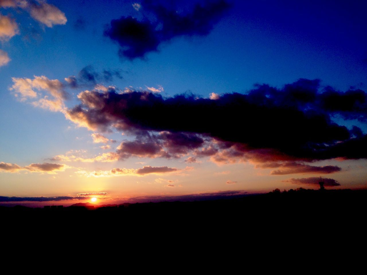 sky, sunset, silhouette, scenics, tranquil scene, beauty in nature, tranquility, cloud - sky, dramatic sky, nature, landscape, cloud, idyllic, cloudy, dark, atmospheric mood, dusk, majestic, moody sky, blue