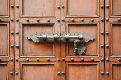 Bolt lock on an old wooden door in florence, tuscany, italy