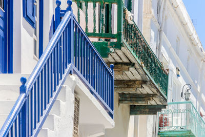 Low angle view of staircase amidst buildings in city