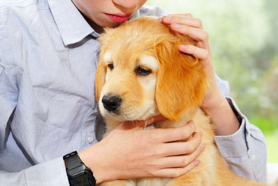 Midsection of of boy with dog