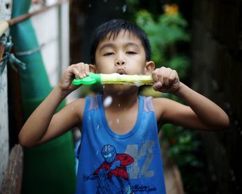 Portrait of boy eating food