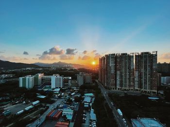 High angle view of buildings against sky during sunset