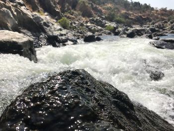 Close-up of waves splashing on rocks