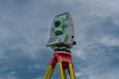 Low angle view of red toy against sky