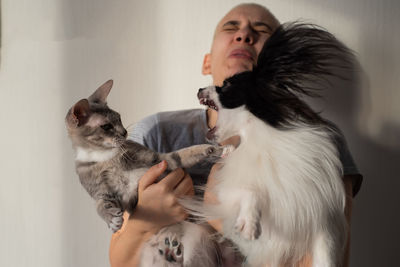 Young woman with cat at home